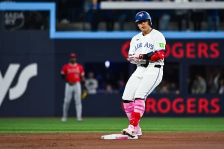 Toronto Blue Jays third baseman Kazuma Okamoto (7) gets to second base after hitting a RBI double against the Los Angeles Angels in the first inning at Rogers Centre.