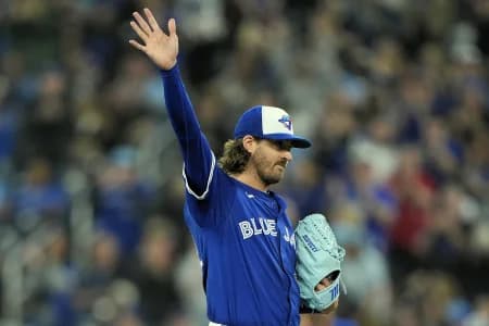 Toronto Blue Jays starting pitcher Kevin Gausman (34) waves to the fans after he is acknowledged for getting his 2,000th career strike out during the fourth inning against the Tampa Bay Rays at Rogers Centre.