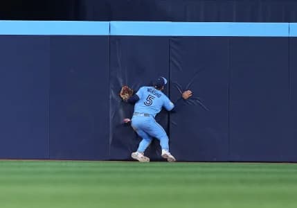 Toronto Blue Jays center fielder Daulton Varsho (5) catches a fly ball for an out against the Tampa Bay Rays during the tenth inning at Rogers Centre.