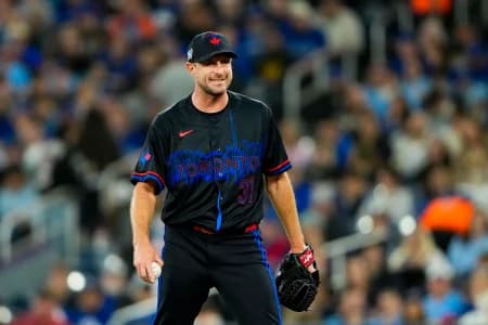 Toronto Blue Jays pitcher Max Scherzer (31) smiles in between pitches against the Cleveland Guardians at Rogers Centre.