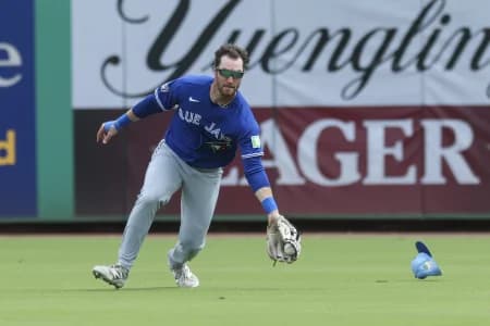 Toronto Blue Jays left fielder RJ Schreck (9) catches a ball for an pout against the Philadelphia Phillies in the third inning during spring training at BayCare Ballpark.