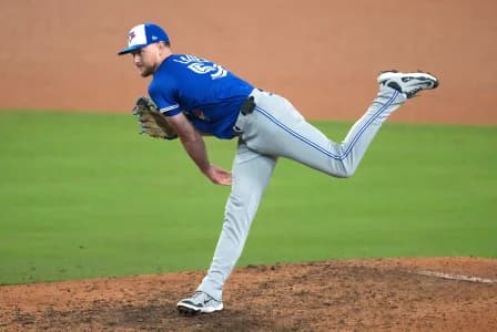 Toronto Blue Jays pitcher Eric Lauer (56) throws during the twelfth inning against the Los Angeles Dodgers in game three of the 2025 MLB World Series at Dodger Stadium.