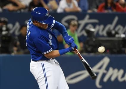 Toronto Blue Jays shortstop Gio Urshela (3) hits a run scoring single against Oakland Athletics in the fifth inning at Rogers Centre.