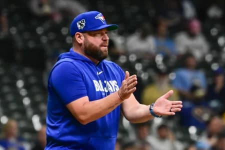 Toronto Blue Jays manager John Schneider makes a pitching change in the seventh inning against the Milwaukee Brewers at American Family Field.