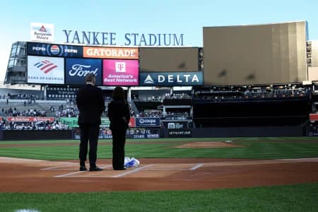 Broadcasters Michael Kay and Suzyn Waldman honor Yankees radio play-by-play announcer John Sterling before the game between the New York Yankees and the Baltimore Orioles at Yankee Stadium.