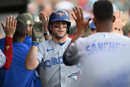 Toronto Blue Jays second baseman Ernie Clement (22) celebrates in the dugout after scoring a run against the Detroit Tigers in the second inning at Comerica Park.