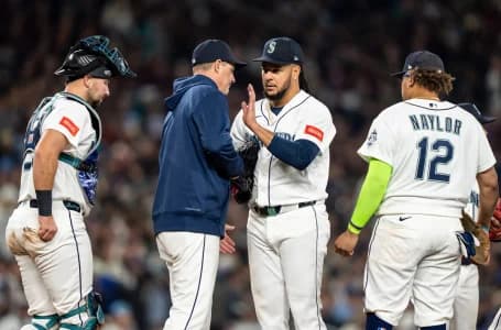 Seattle Mariners manager Dan Wilson, second from left, pulls starting pitcher Luis Castillo (58) from the game during a meeting at mound with catcher Cal Raleigh (29) and first baseman Josh Naylor (12)in the fourth inning against the Houston Astros at T-Mobile Park.