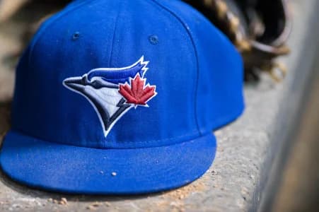A view of a Toronto Blue Jays ball cap and logo during the game between the Texas Rangers and the Blue Jays at Globe Life Park in Arlington. The Blue Jays shut out the Rangers 2-0