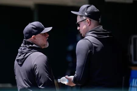 Detroit Tigers pitcher Tarik Skubal (29), right, talk to assistant pitching coach Robin Lund (63) in the dugout during the fourth inning between Detroit Tigers and Cleveland Guardians at Comerica Park in Detroit on Thursday, May 21, 2026.
