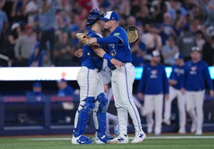 Toronto Blue Jays catcher Brandon Valenzuela (59) celebrates the win with relief pitcher Tanner Andrews (43) against the Miami Marlins at the end of the ninth inning at the Rogers Centre.