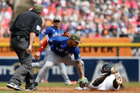 Detroit Tigers second baseman Zach McKinstry (39) is tagged out at third by Toronto Blue Jays second baseman Lenyn Sosa (50) after he tries to steal the base in the seventh inning at Comerica Park.