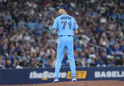 Toronto Blue Jays relief pitcher Tyler Rogers (71) gets ready to throw a pitch against the Boston Red Sox during the eighth inning at Rogers Centre.