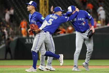 Toronto Blue Jays players celebrate after a game against the Baltimore Orioles at Oriole Park at Camden Yards.