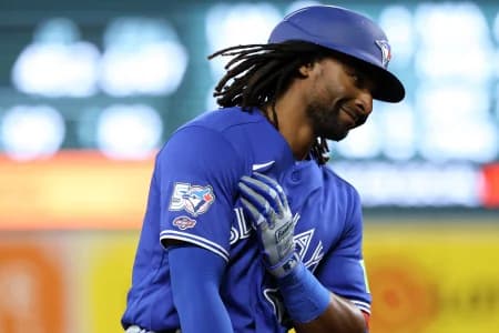 Toronto Blue Jays second baseman Charles McAdoo (26) celebrates after hitting his first career hit/home run during the seventh inning against the Baltimore Orioles at Oriole Park at Camden Yards.