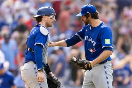 Toronto Blue Jays pitcher Jordan Romano (68) and catcher Danny Jansen (9) react to a victory against the Philadelphia Phillies at Citizens Bank Park
