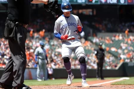 Toronto Blue Jays second baseman Ernie Clement (22) scores a run during the seventh inning against the Baltimore Orioles at Oriole Park at Camden Yards.