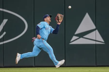 Toronto Blue Jays center fielder Daulton Varsho (5) makes a running catch on a ball hit by Atlanta Braves center fielder Michael Harris II (23) (not pictured) during the eighth inning at Truist Park.