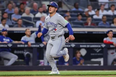 Toronto Blue Jays center fielder Daulton Varsho (5) runs to home in the fourth inning against the New York Yankees at Yankee Stadium.