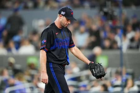 Toronto Blue Jays pitcher Max Scherzer (31) walks to the dugout during the third inning after being relieved at a MLB game against the Cleveland Guardians at Rogers Centre.