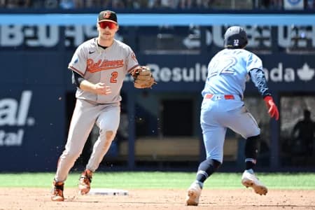 Baltimore Orioles shortstop Gunnar Henderson (2) misses a tag on Toronto Blue Jays second baseman Ernie Clement (22) for a fielding error in the sixth inning at Rogers Centre.
