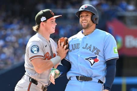 Toronto Blue Jays designated hitter George Springer (4) is tagges out at first base by Baltimore Orioles second baseman Jackson Holliday (7) after being caught in a baseline rundown in the fourth inning at Rogers Centre.