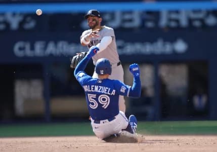 New York Yankees shortstop Jose Caballero (72) tags out Toronto Blue Jays catcher Brandon Valenzuela (59) at second base during the sixth inning at Rogers Centre.