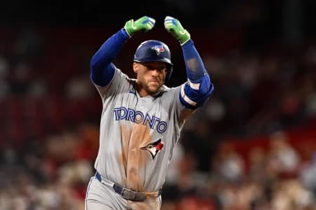 Toronto Blue Jays designated hitter George Springer (4) reacts after hitting a home run against the Boston Red Sox during the ninth inning at Fenway Park.