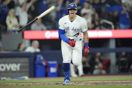 Toronto Blue Jays catcher Brandon Valenzuela (59) tosses his bat and reacts after hitting a walk off RBI single to win the game against the Philadelphia Phillies during the ninth inning at Rogers Centre.