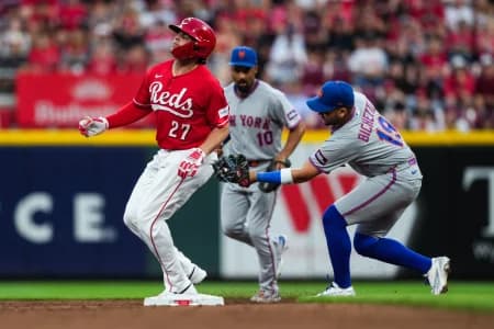 Cincinnati Reds first baseman Sal Stewart (27) is tagged out attempting to steal second base by New York Mets shortstop Bo Bichette (19) in the third inning at Great American Ball Park.
