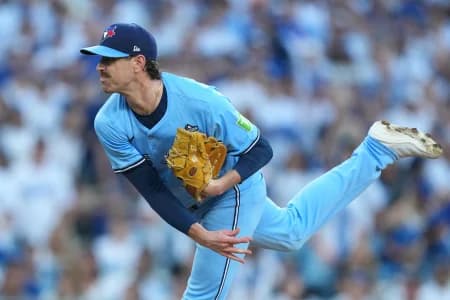 Toronto Blue Jays pitcher Shane Bieber (57) pitches against the Los Angeles Dodgers in the first inning during game four of the 2025 MLB World Series at Dodger Stadium.