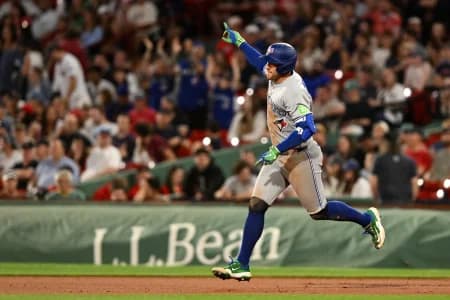 Toronto Blue Jays designated hitter George Springer (4) reacts after hitting a home run against the Boston Red Sox during the ninth inning at Fenway Park.