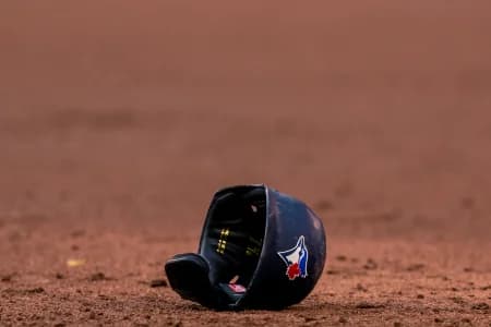 Toronto Blue Jays helmet lays on the infield at an MLB game against the Cleveland Indians at Rogers Centre.