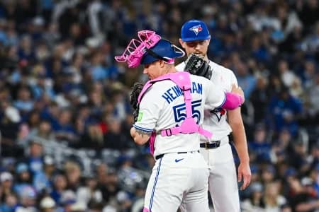 Toronto Blue Jays catcher Tyler Heineman (55) has a discussion with starting pitcher Eric Lauer (56) against the Los Angeles Angels in the fifth inning at Rogers Centre.