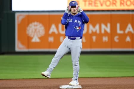 Toronto Blue Jays center fielder Daulton Varsho (5) celebrates after hitting a double during the seventh inning against the Baltimore Orioles at Oriole Park at Camden Yards.