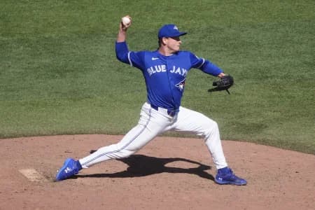 Toronto Blue Jays starting pitcher Louie Varland (77) pitches to the Texas Rangers during the ninth inning at Rogers Centre.