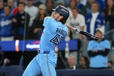 Toronto Blue Jays third baseman Addison Barger (47) hits a double against the Los Angeles Dodgers in the ninth inning for game six of the 2025 MLB World Series at Rogers Centre.