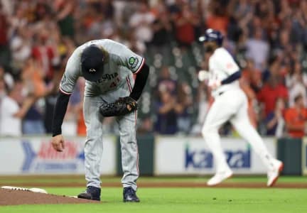 Minnesota Twins starting pitcher Joe Ryan (41) reacts to Houston Astros left fielder Yordan Alvarez (44) grand slam home run in the fourth inning at Daikin Park