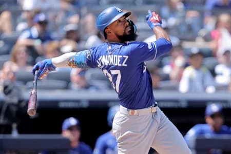 Los Angeles Dodgers left fielder Teoscar Hernandez (37) follows through on an RBI ground-rule double against the New York Yankees during the eighth inning at Yankee Stadium.