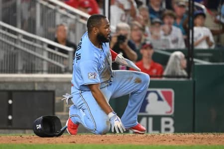 Toronto Blue Jays first baseman Vladimir Guerrero Jr. (27) kneels after being thrown out at home against the Washington Nationals during the fifth inning at Nationals Park.