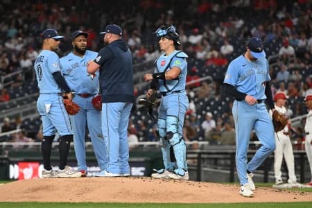 Toronto Blue Jays pitcher Shane Bieber (57) is removed from the game during the first inning by manager John Schneider (14) against the Washington Nationals at Nationals Park.