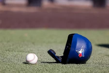 Toronto Blue Jays batting helmet lays on the ground during workouts at Toronto Blue Jays Player Development Complex