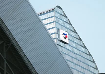 The Toronto Dominion Bank Building displays the Toronto Blue Jays logo against the New York Yankees during the eighth inning in game one of the ALDS round for the 2025 MLB playoffs at Rogers Centre.