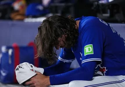 Toronto Blue Jays starting pitcher Kevin Gausman (34) sits in the dugout against the Tampa Bay Rays during the first inning at Rogers Centre.