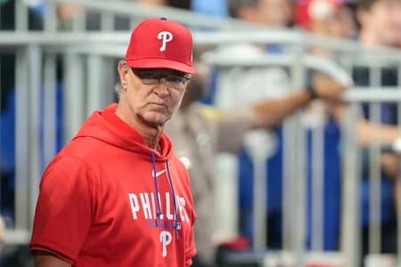 Philadelphia Phillies interim manager Don Mattingly (8) looks on from inside the dugout against the Miami Marlins during the seventh inning at loanDepot Park