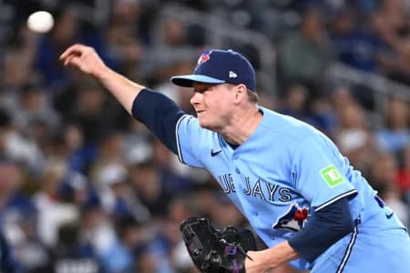 Toronto Blue Jays relief pitcher Louis Varland (77) delivers a pitch against the Tampa Bay Rays in the ninth inning at Rogers Centre.