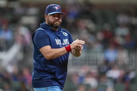 Toronto Blue Jays manager John Schneider (14) on the field against the Atlanta Braves during the eighth inning at Truist Park.
