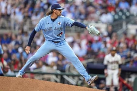 Toronto Blue Jays pitcher Kevin Gausman (34) pitches against the Atlanta Braves during the first inning at Truist Park