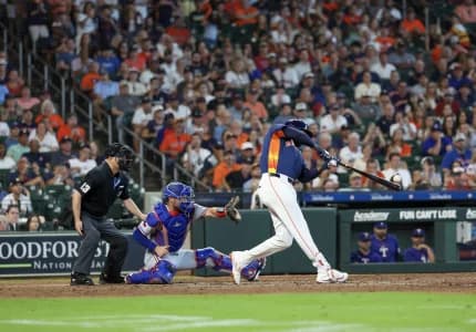 Houston Astros left fielder Yordan Alvarez (44) hits a two run RBI double agains the Texas Rangers in the seventh inning at Daikin Park