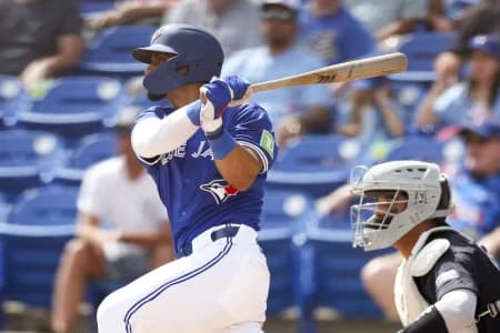 Toronto Blue Jays second baseman Santiago Espinal (5) hits a two rbi double against the New York Yankees in the fifth inning at TD Ballpark.