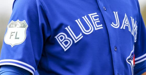Toronto Blue Jays right fielder Jose Bautista (19) jersey as he stretches during spring training at Bobby Mattick Training Center.
